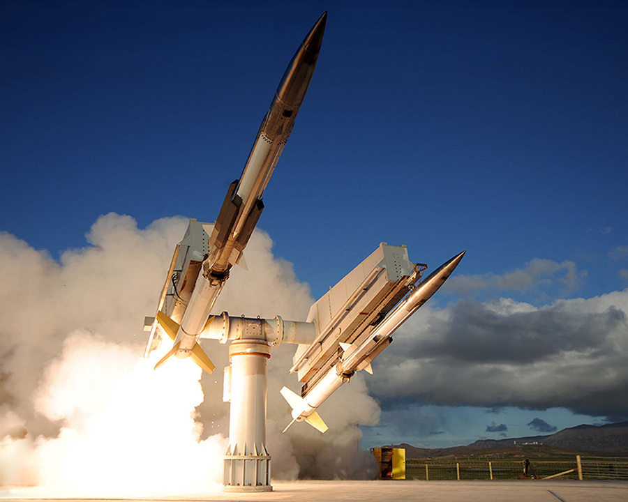 two missiles being launched from earth