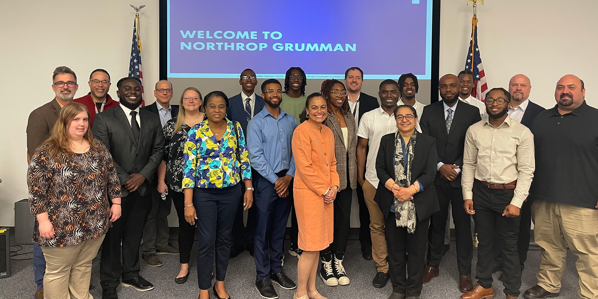 group photo of business people and students