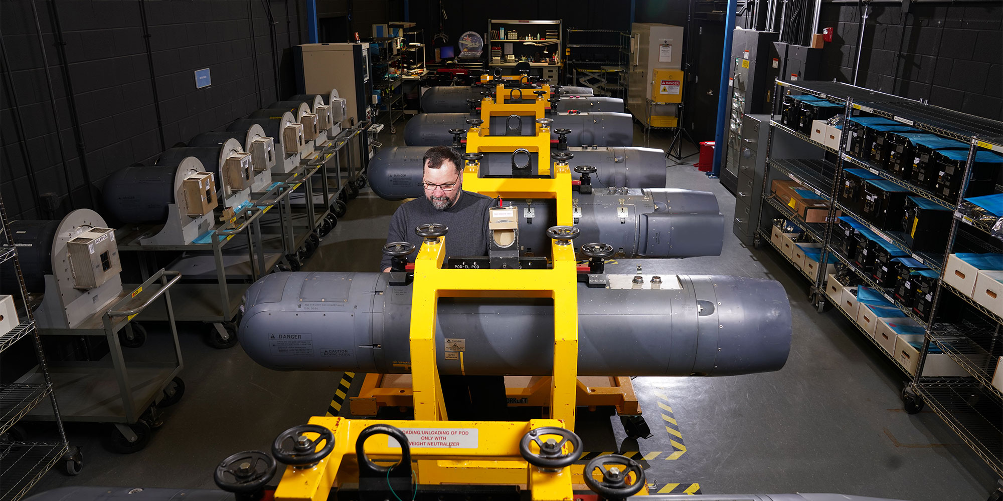 Modernizing Defense Technology employee working in defense technology manufacturing facility