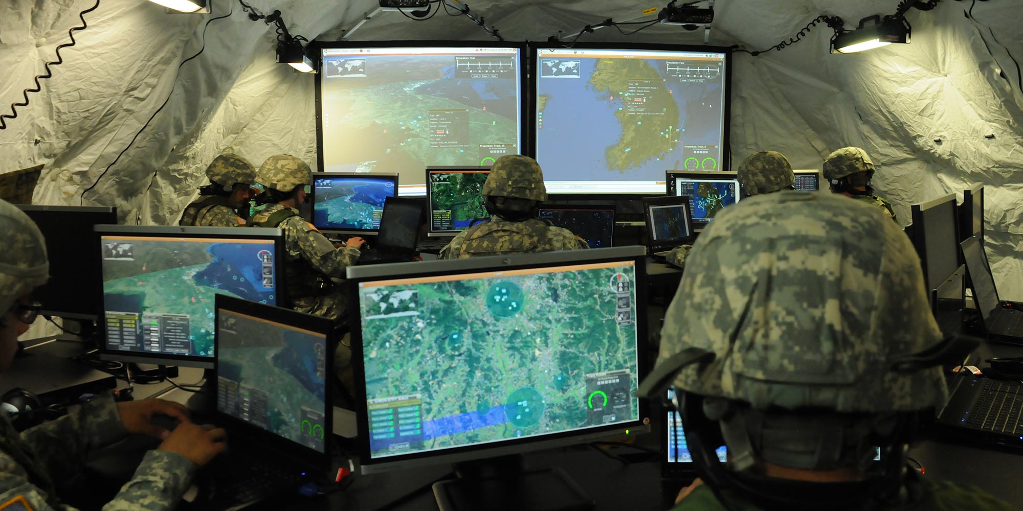 Integrated Air and Missile Defense Battle Command System – IBCS soldiers in tent looking at computer monitors