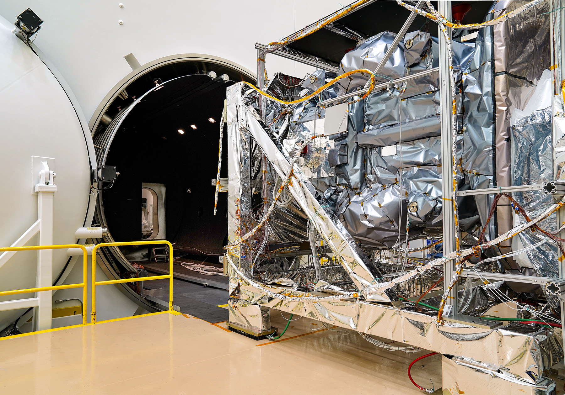 A satellite in a thermal vacumm system in testing facility